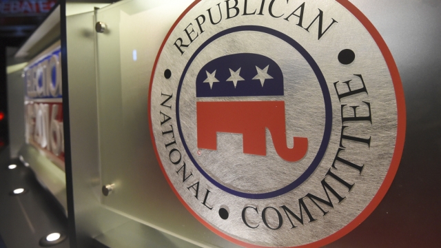 The Republican National Committee logo is shown on a stage.