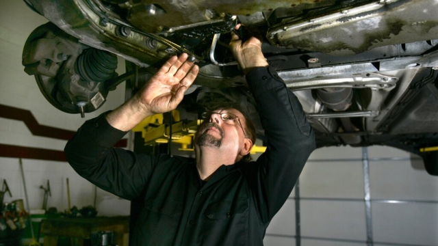 Mechanic Ed Wuerth of Wuerth Automotive works on a car at his shop