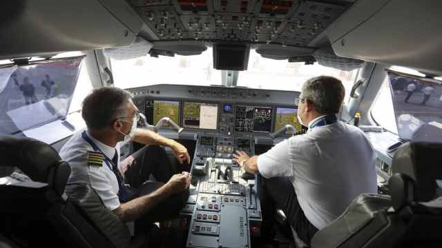 Pilots in the cockpit of a plane