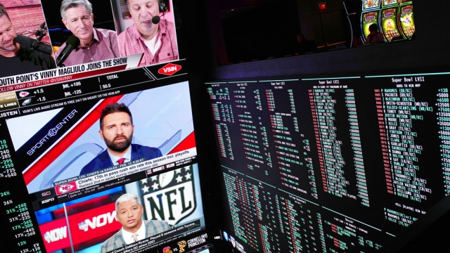 Betting odds for NFL football's Super Bowl are displayed on monitors at the Circa resort and casino sports book