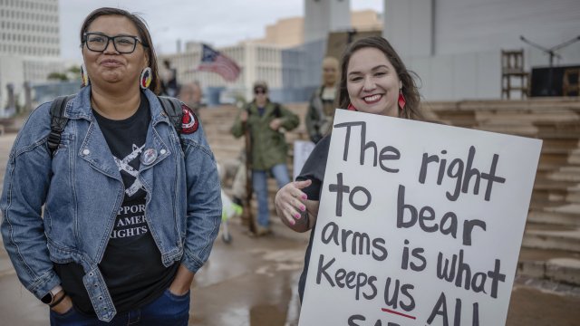Kimberly Wahpepah, left, and April Polichette, attend a Second Amendment Protest