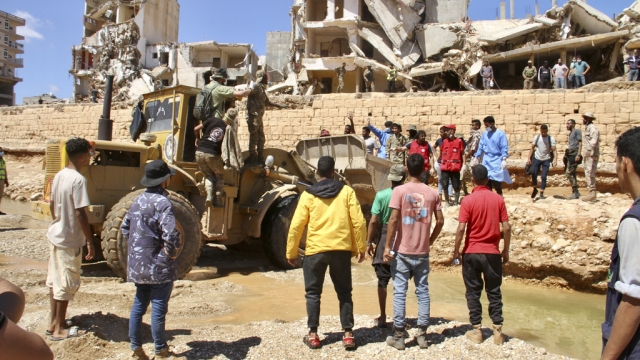 People search for flood survivors in Derna, Libya.