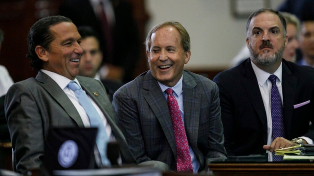 Texas Attorney General Ken Paxton smiling at impeachment trial.