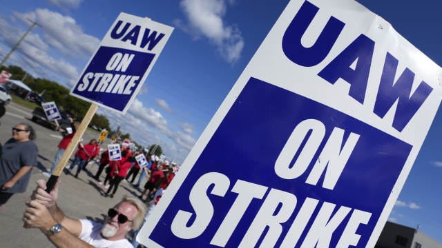 United Auto Workers members walk the picket line