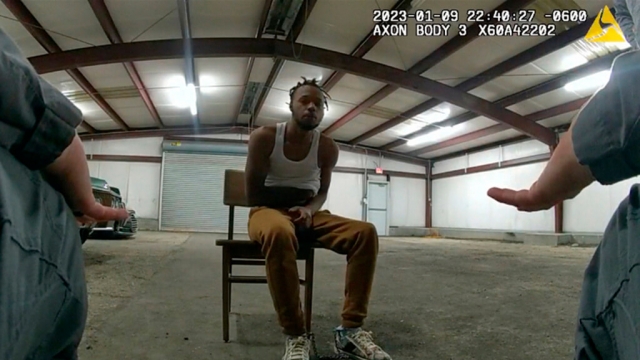 Body camera video shows officers interact with Jeremy Lee inside a warehouse.