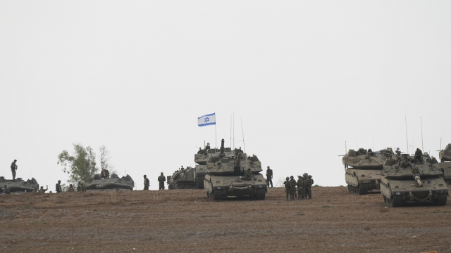 Israeli soldiers are seen in a staging ground near the Israel-Gaza border.