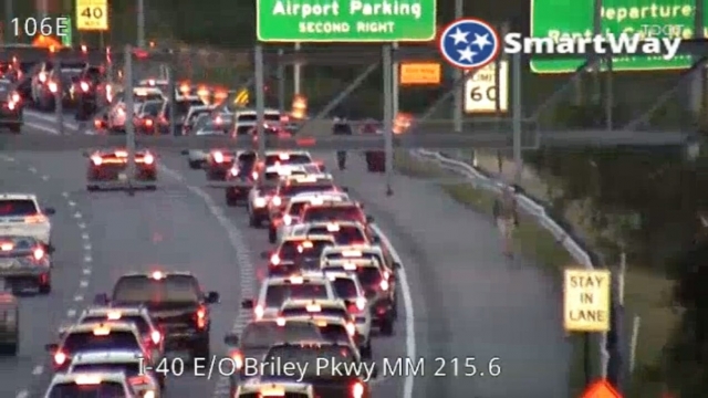 Footage from a TDOT camera on I-40 shows travelers ditching traffic to walk up the shoulder of the interstate in order to cat