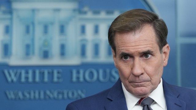 National Security Council spokesman John Kirby listens as he is asked a question.
