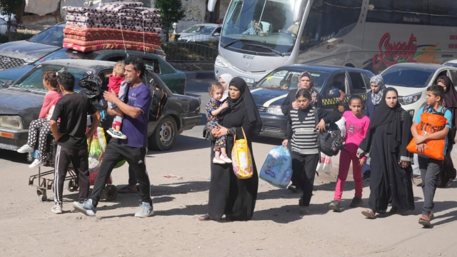 Palestinians flee to the southern Gaza Strip after the Israeli army issued an evacuation warning