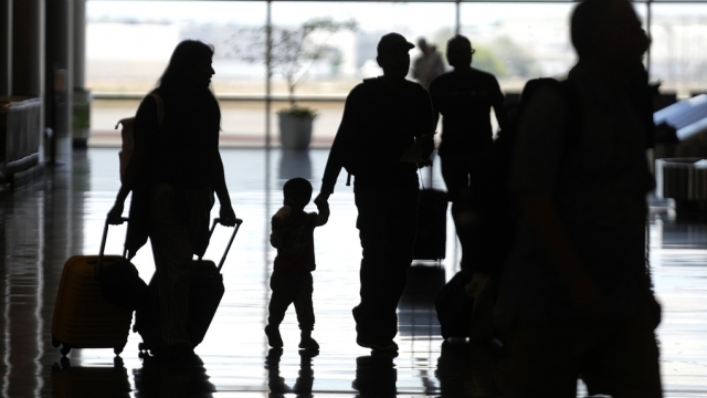 People travel through Salt Lake City International Airport.