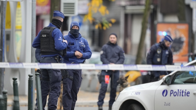 Belgian Police stand guard at the scene of a suspected extremist attack.
