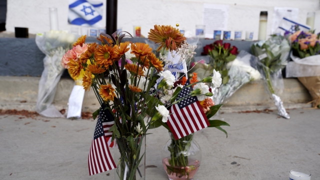 Flowers at a makeshift memorial for a Jewish man who died after an altercation at dueling rallies over the Israel-Hamas war.