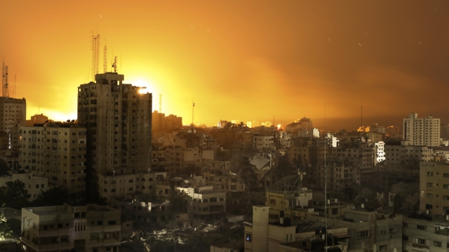 Fire and smoke rises from buildings following Israeli airstrikes on Gaza City.