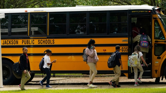 Spann Elementary School students board a school bus in Jackson, Mississippi.