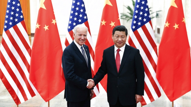 Chinese President Xi Jinping shakes hands with U.S President Joe Biden.