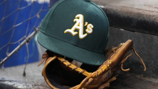 An Oakland Athletics hat and glove.