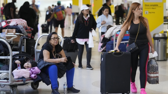 Travelers in an airport ahead of Thanksgiving