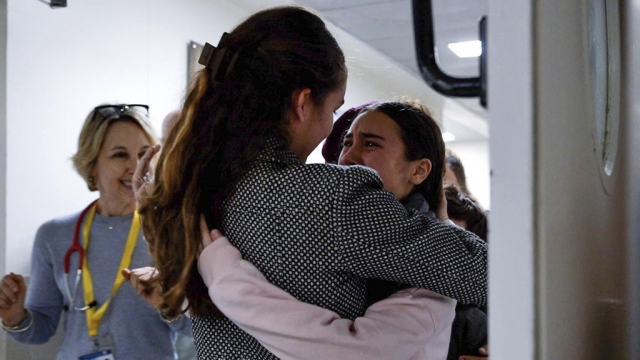 Israeli hostage Sahar Kalderon, 16, embraced by a relative upon her arrival at Sourasky Medical Center.