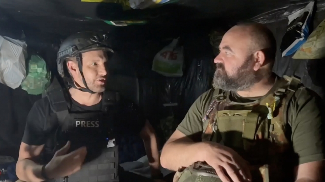 Scripps News correspondent Jason Bellini, left, speaking to Ukrainian Chief Sergeant "Psih."