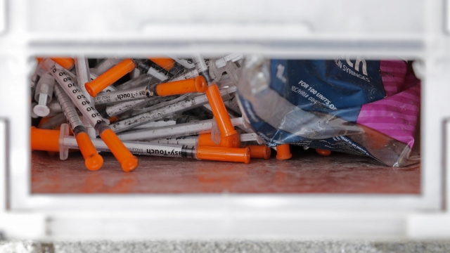 A box of needles collected at a homeless encampment