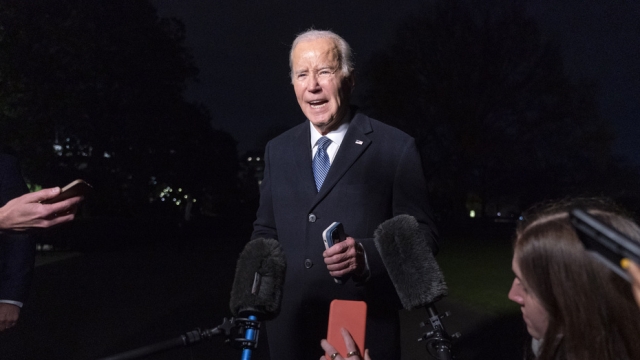 President Joe Biden speaks to reporters as he returns to the White House.