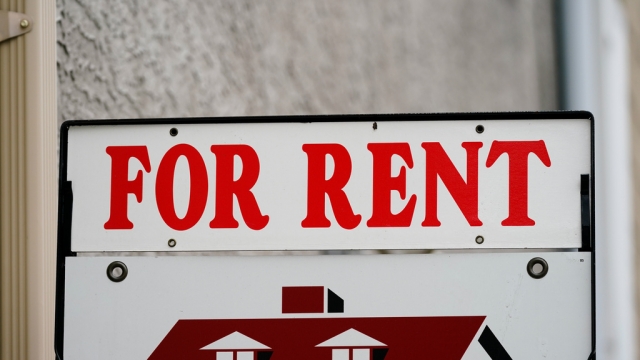 A "For Rent" sign is displayed outside a building in Philadelphia.