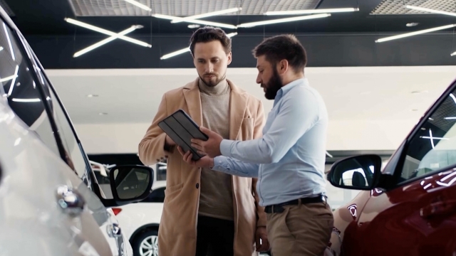 Car salesman with a customer