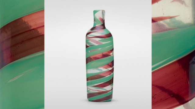 Red and seafoam green swirl-patterned glass vase