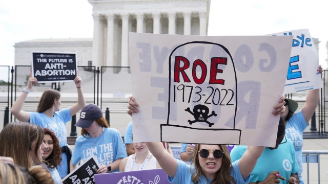 Demonstrators protest about abortion outside the Supreme Court in Washington.