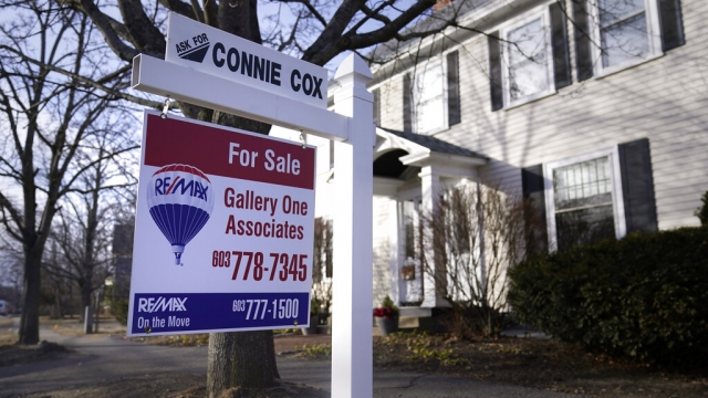 A sign announcing a house for sale is posted outside a single family home, Tuesday, Feb. 7, 2023, in Exeter, N.H.
