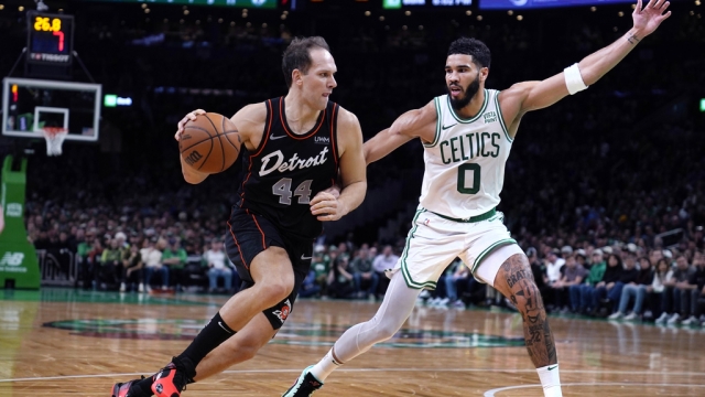 Detroit Pistons forward Bojan Bogdanovic (44) drives to the basket against Boston Celtics forward Jayson Tatum (0).