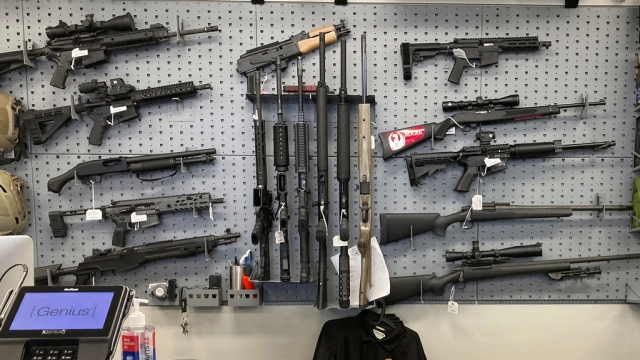 Firearms are displayed at a gun shop.