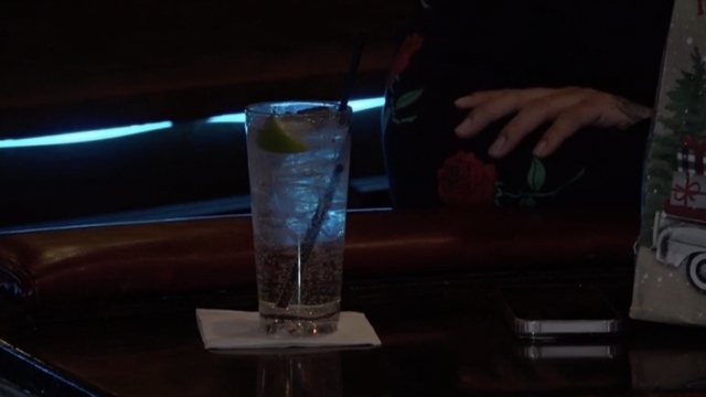 A drink sitting at a bar