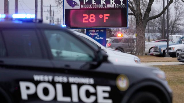 Police respond to the scene of a school shooting in Perry, Iowa, on Thursday, Jan. 4, 2024