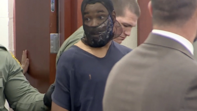 Deobra Redden is escorted into a Las Vegas courtroom.