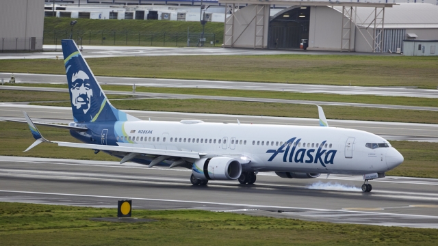 File photo of an Alaska Airlines flight, a Boeing 737-900, landing at an airport.