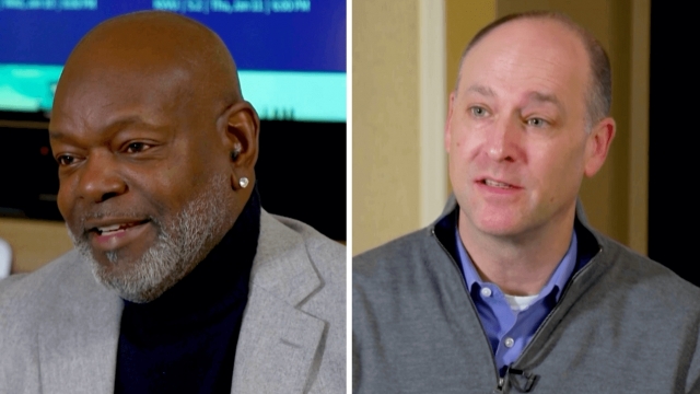 NFL Hall of Famer Emmitt Smith, left, and Scripps CEO Adam Symson, right