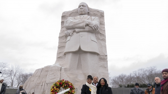 Martin Luther King III, center, accompanied by his daughter Yolanda Renee King, left, and his wife Andrea Waters King