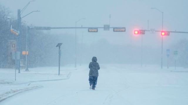 A person on a snow-covered road in Texas
