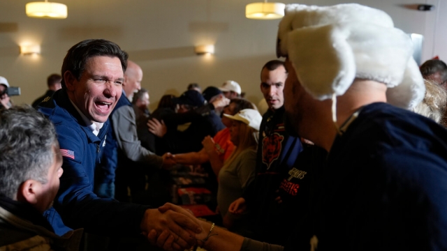 Florida Gov. Ron DeSantis shakes hands with a supporter in Iowa