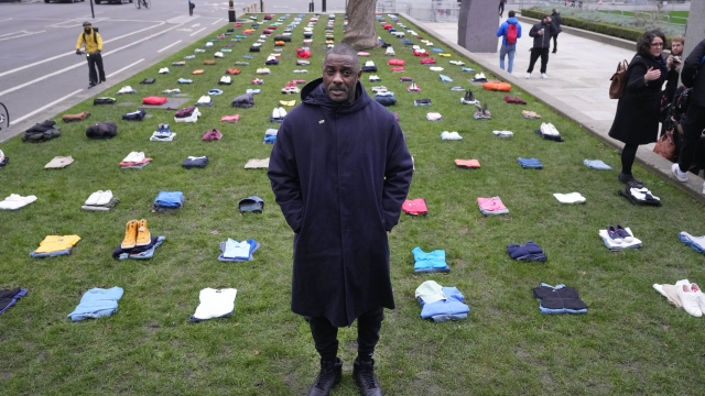 British Actor Idris Elba stands in Parliament Square with clothing representing the human cost of UK Knife Crime