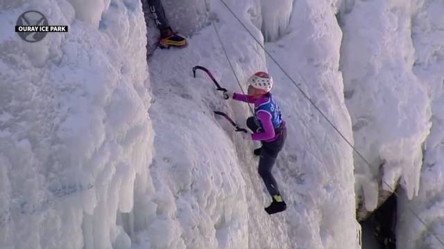 An ice-climbing climber