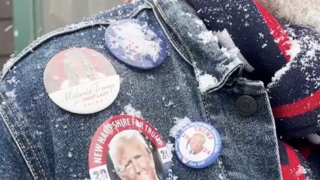 Voter with Trump support pins on his jacket.