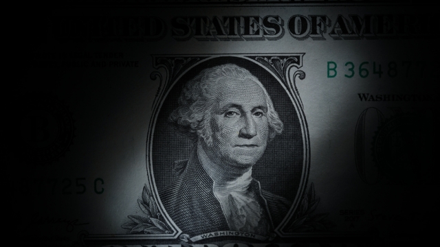 The likeness of George Washington is seen on a U.S. one dollar bill.