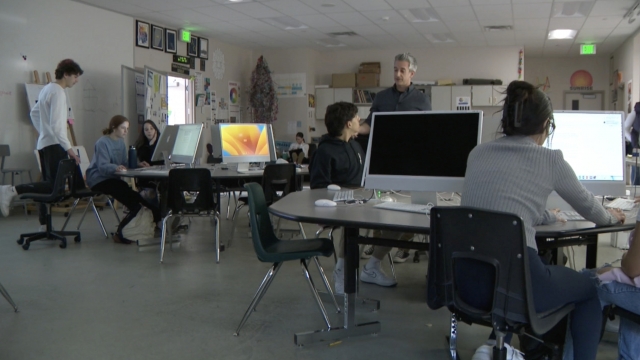 Students at a high school in Arora, Colorado work on their year book.
