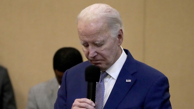 President Biden bows his head in a moment of silence for the three American troops killed Sunday.