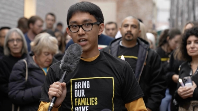 Harrison Li speaking at a protest for "Bring Our Families Home."