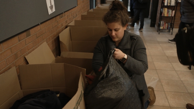 Lead volunteer Jessica Leving Siegel sorting through donation inside the Wilmette train station