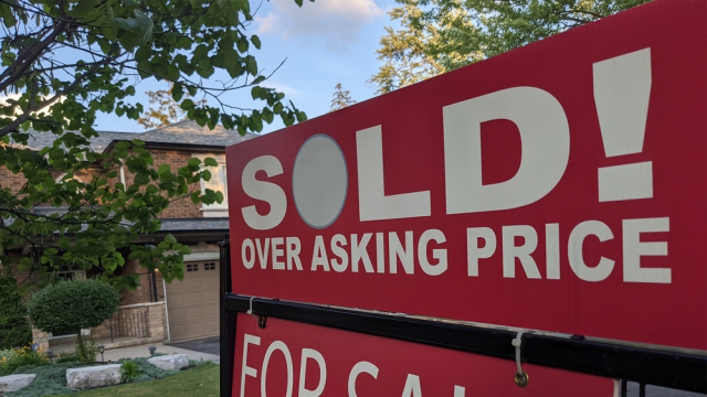 Sign in front of house says "Sold! Over asking price"