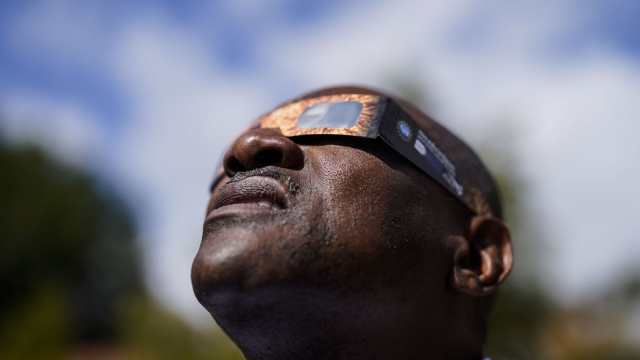 Dan Baker views a partial solar eclipse, Saturday, Oct. 14, 2023, in Marietta, Ga.